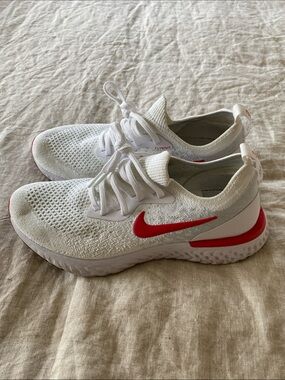 Nike White Flyknit Trainers with Red Swoosh